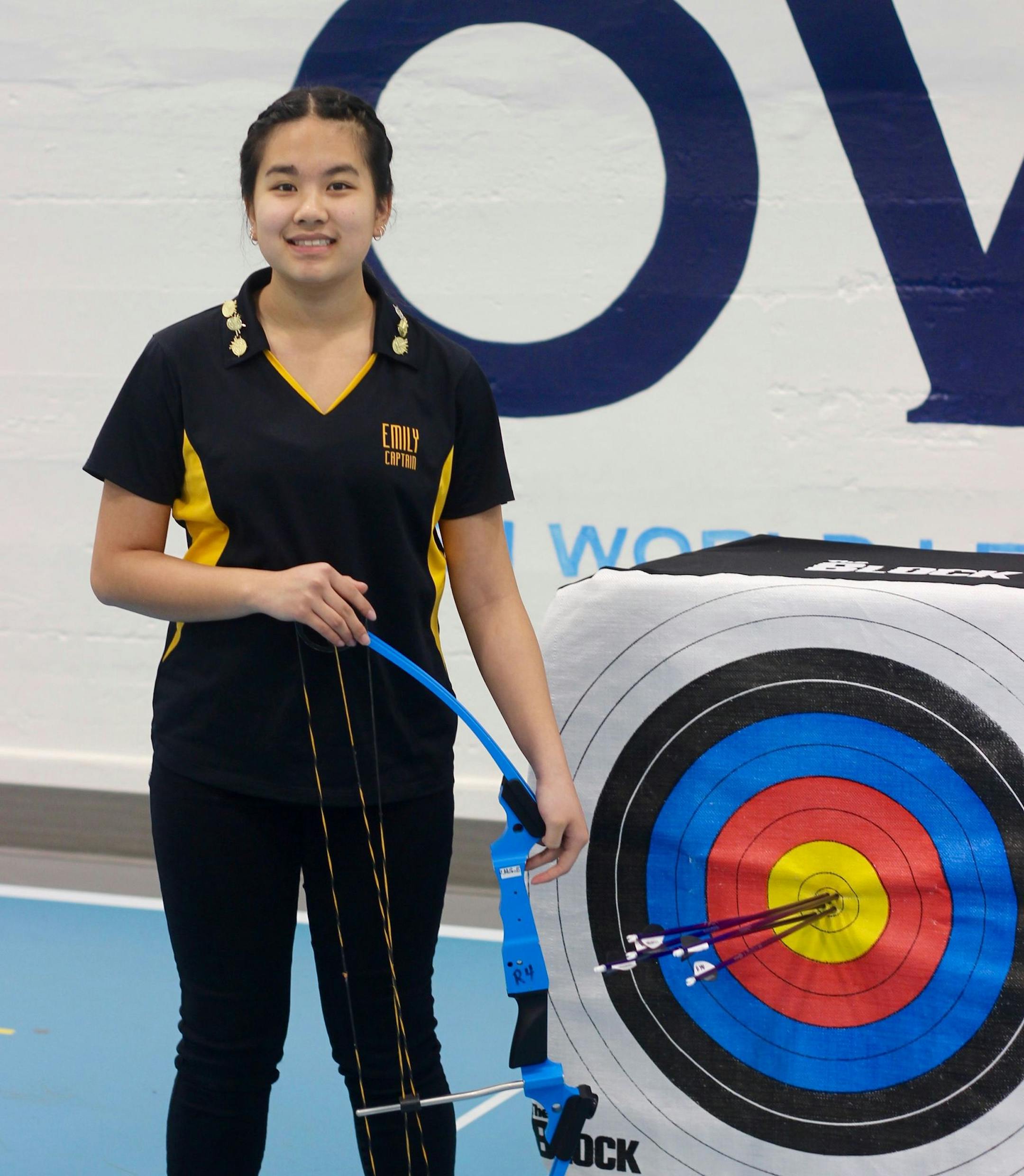 Emily Yang posed proudly on the archery range. (Photo by Abby Davis)