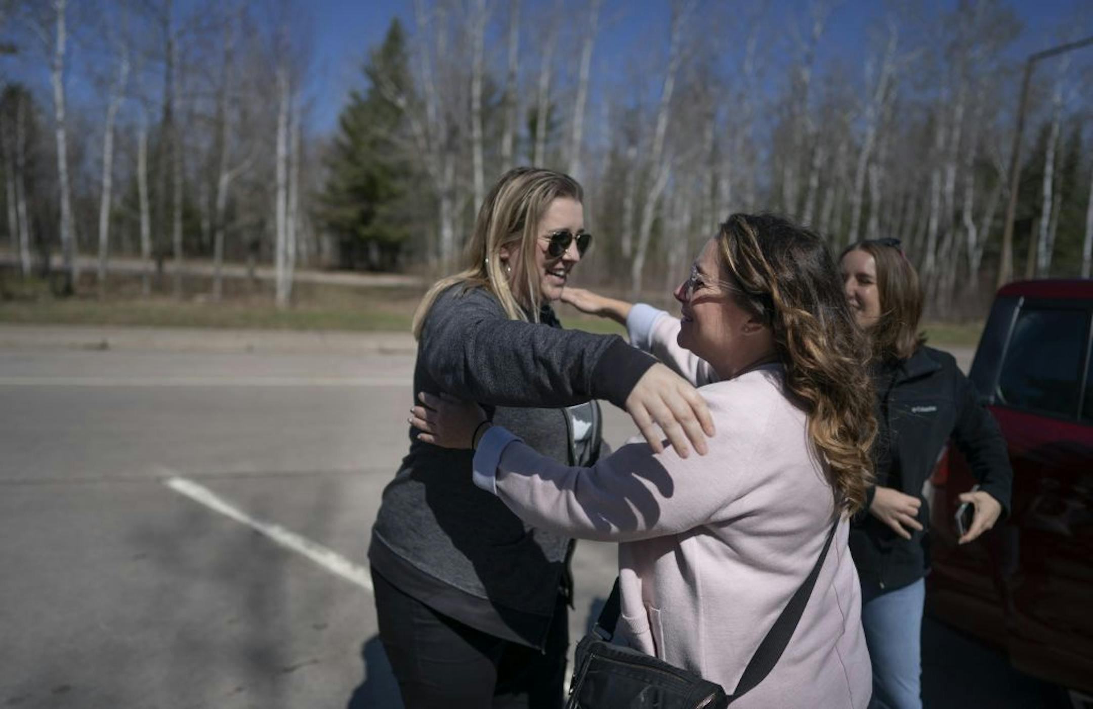 Quinn Nystrom of left hugged Vicky Luedtke as the meet at rest stop Saturday May 4, 2019 on their way to Ft. Frances, Ontario.