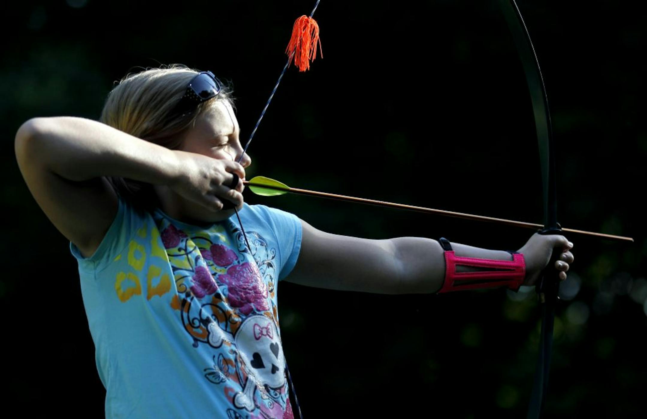 CeCe Holmes, 12, of Greenfield prepared for a shot during an archery class at Baker Near Wilderness Settlement in Maple Plain, Minn on Thursday.