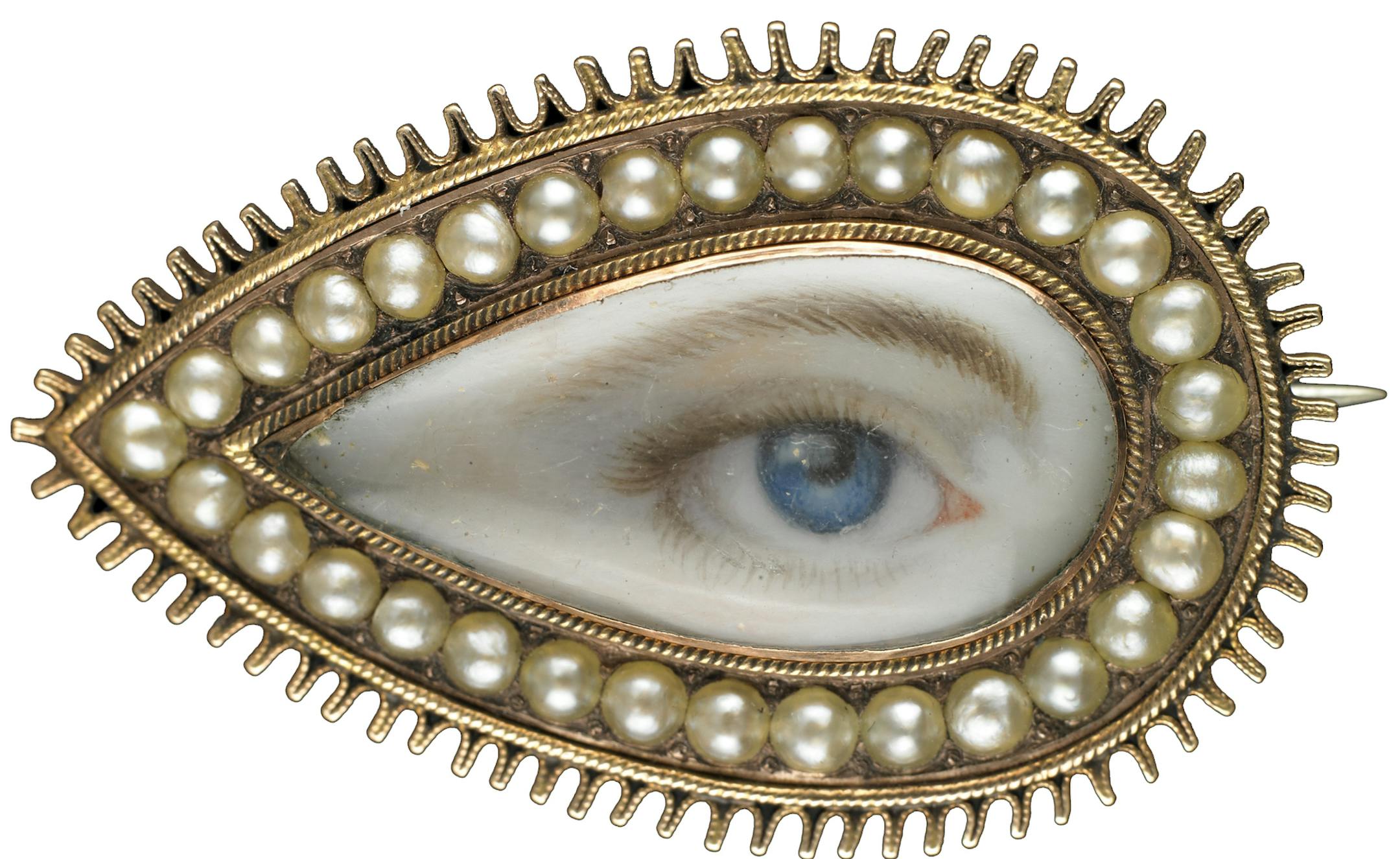 Minneapolis Institute of Arts The Look of Love: Eye Miniatures from the Skier Collection Gold teardrop-shaped brooch surrounded by split pearls, ca. 1790 Brown left eye. Dimensions: 3/4 √ó 1 1/4 √ó 1/4 in.