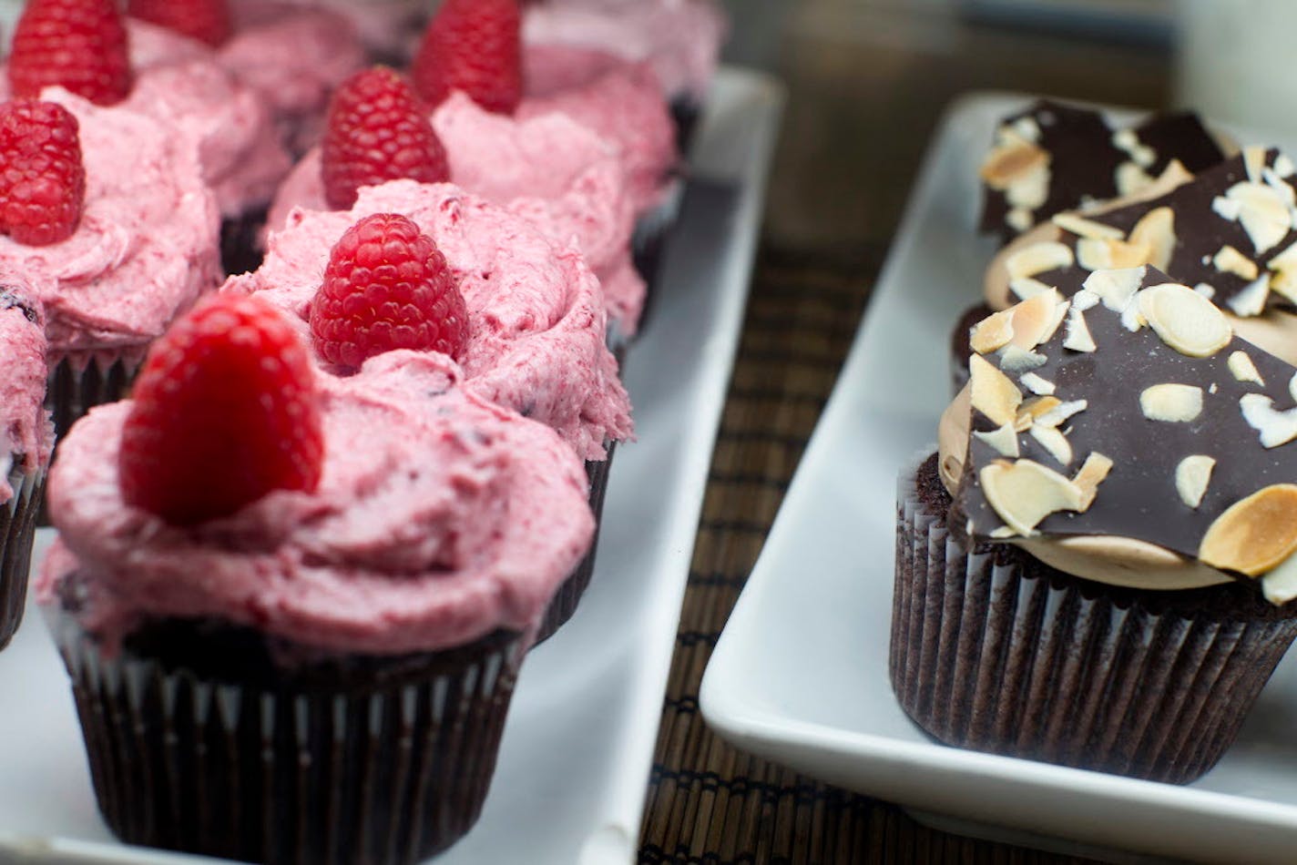 Raspberry and flourless chocolate cupcakes are two of the many fresh-baked items for sale at Salty Tart in Midtown Global Market in Minneapolis September 21, 2013. (Courtney Perry/Special to the Star Tribune)