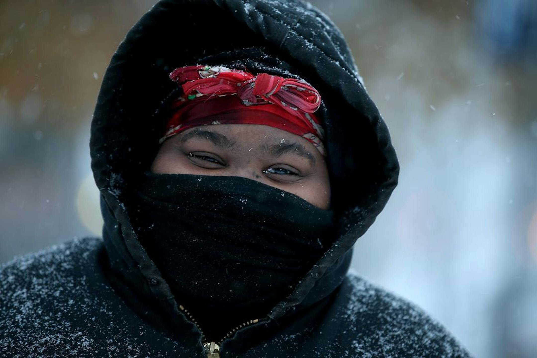 Vanessa Gross bundled up as she made her way from the school bus to home early Tuesday, November 11, 2014 in Minneapolis, MN.