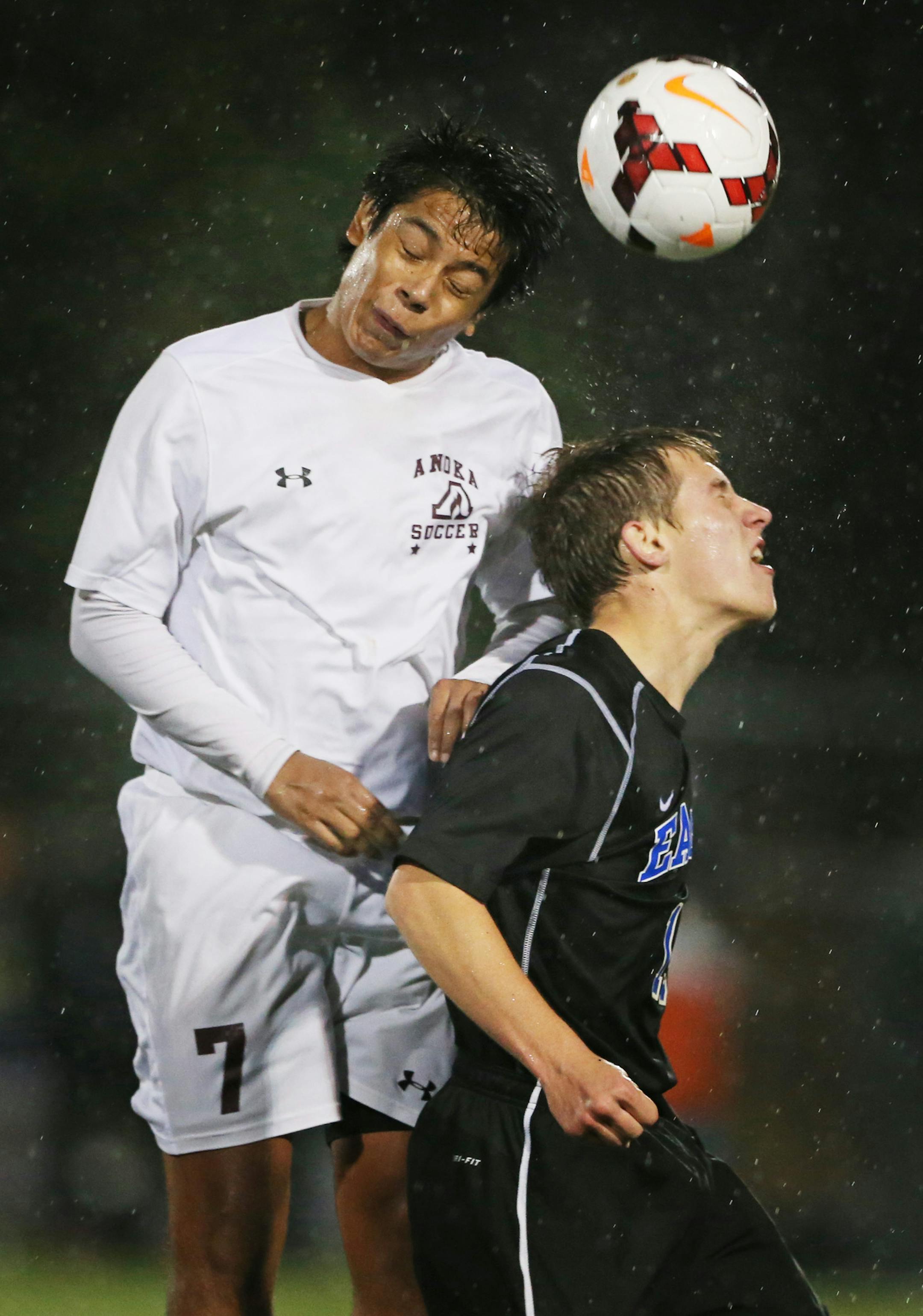 Anika Miguel Martinez-Urrutia headed the ball away from Eagan Ryan Conroy during Class 2A boy's soccer state quarter final action Tuesday October 27, 2015 in St. Louis Park, MN. ] Anoka beat Eagan 2-1 in Class 2A boy's soccer state quarter final at Benilde-St. Margaret's High school . Jerry Holt/ Jerry.Holt@Startribune.com