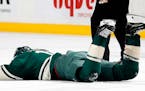The Wild's Zach Parise (11) was hit in the face with a high stick by Washington's Tom Wilson in the first period Tuesday night. ] CARLOS GONZALEZ � 