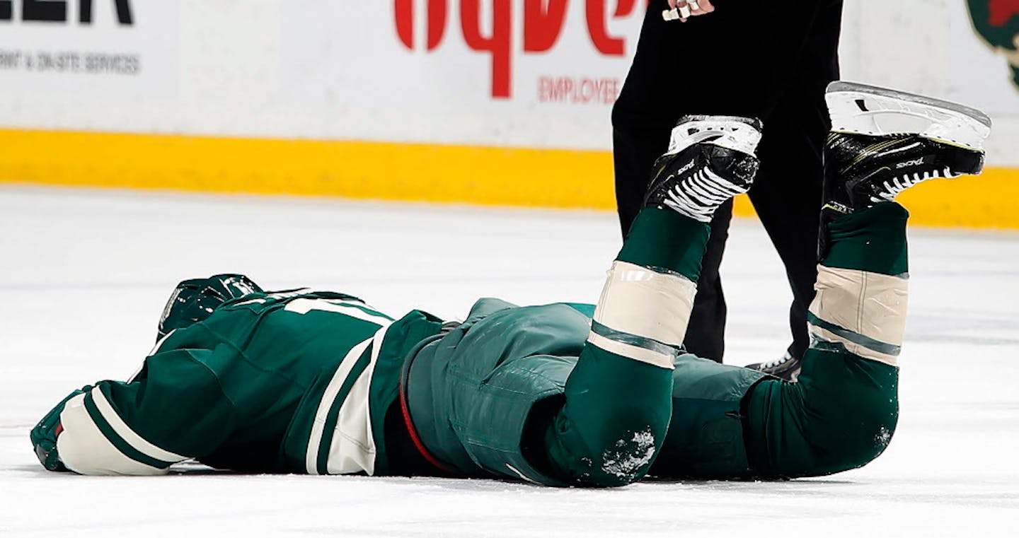 The Wild's Zach Parise (11) was hit in the face with a high stick by Washington's Tom Wilson in the first period Tuesday night. ] CARLOS GONZALEZ � cgonzalez@startribune.com - March 28, 2017, St. Paul, MN, Xcel Energy Center, NHL, Hockey, Minnesota Wild vs. Washington Capitals