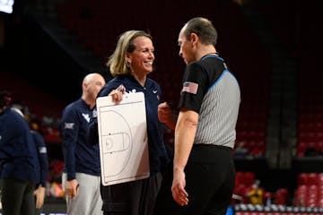 Dawn Plitzuweit talked to an official during Friday’s loss for her West Virginia team in the NCAA tournament against Arizona.