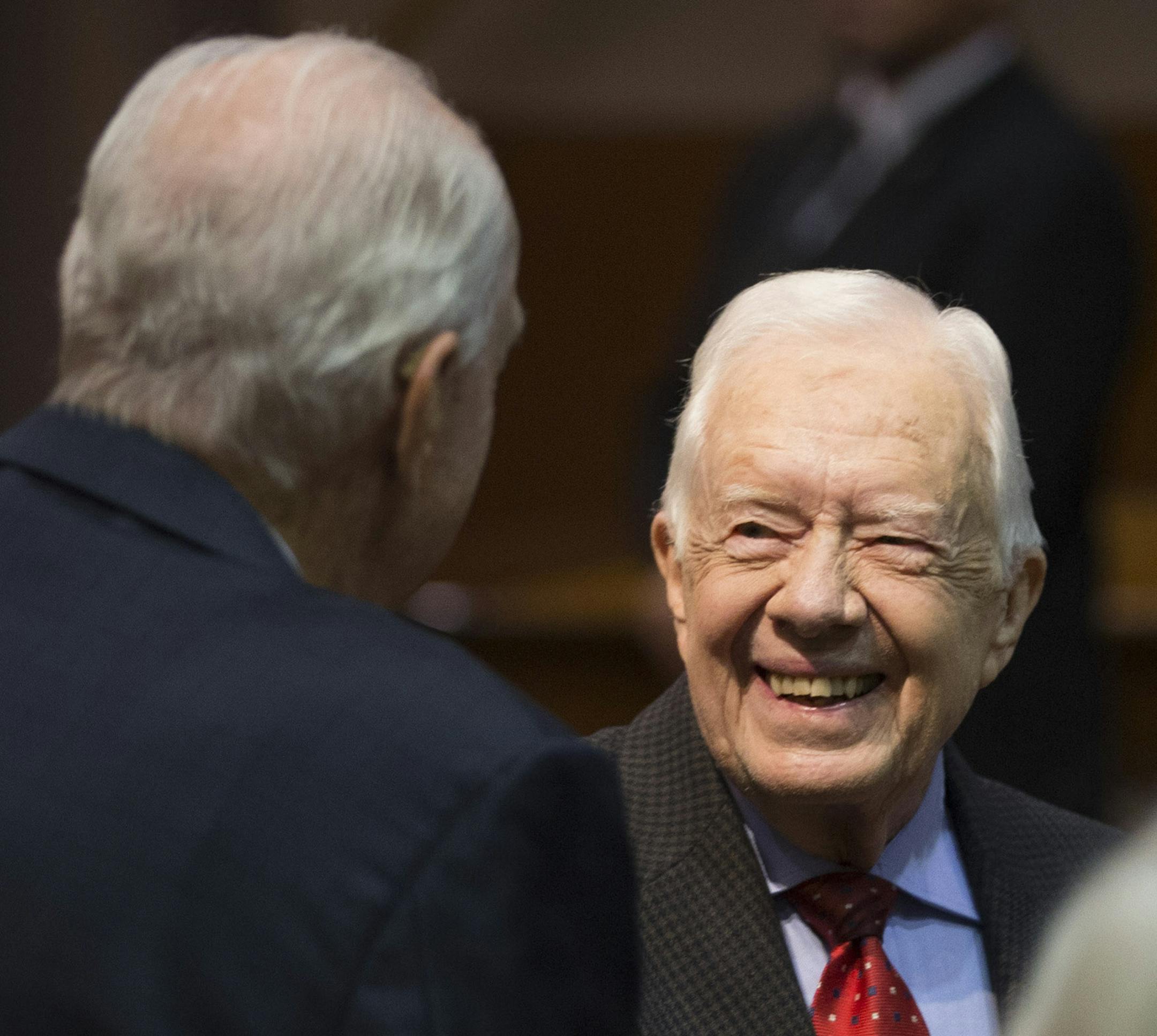 FILE -- Former President Jimmy Carter greets people before speaking at a news conference at The Carter Center in Atlanta, Aug. 20, 2015. In an interview on Monday, May 23, 2016, defending President Barack Obama and criticizing Donald Trump, Carter said the presidential race showed how much work needed to be done to heal racial divisions. (Kevin D. Liles/The New York Times)