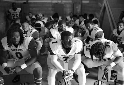 Mesabi Range players including, from left, Elvin Turner, Andre Bell and Kalil Grice, sat in the visiting team locker room moments before their season kicked off against Ridgewater in Willmar in late August.