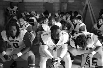 Mesabi Range players including, from left, Elvin Turner, Andre Bell and Kalil Grice, sat in the visiting team locker room moments before their season 