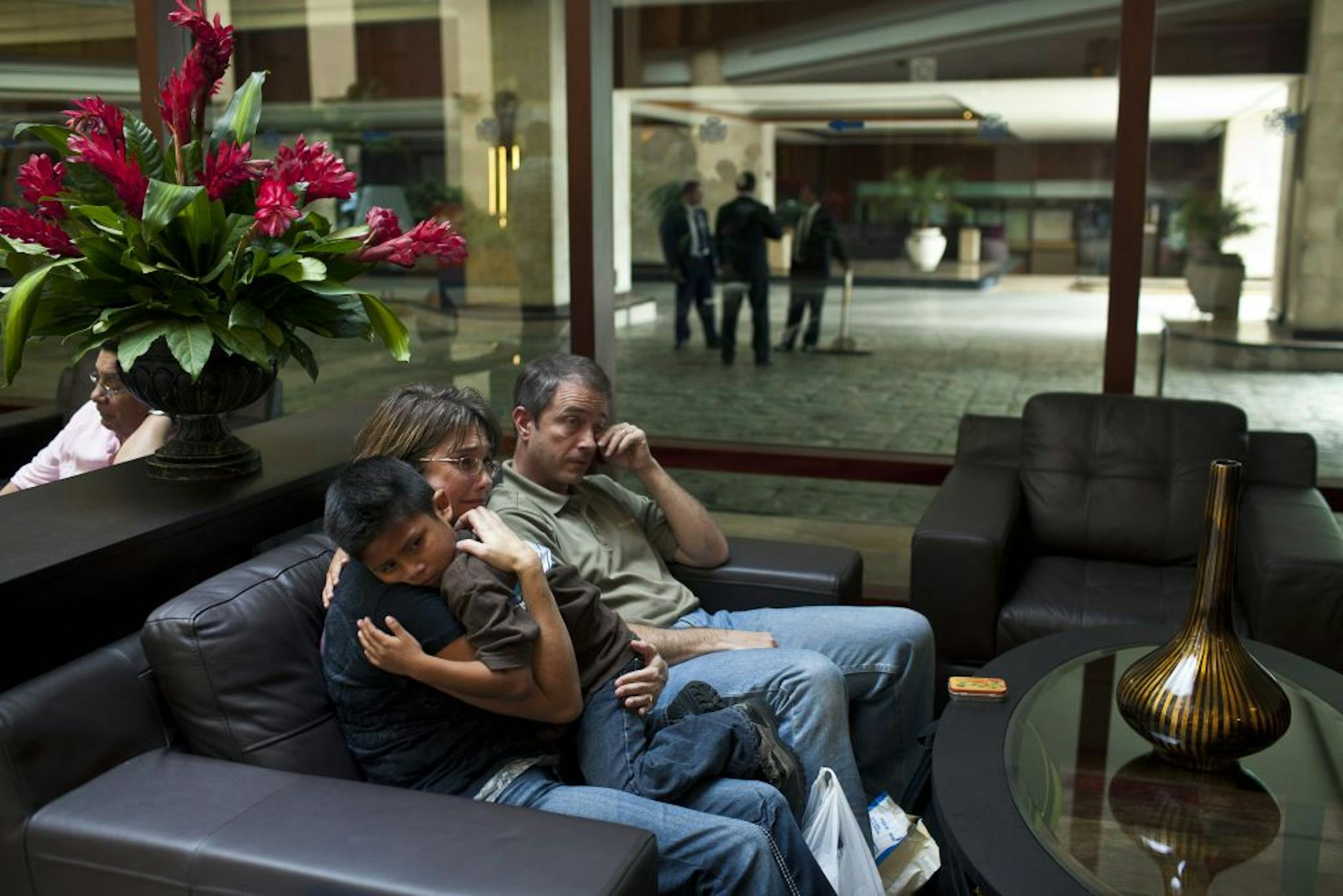 Amy and Rob Carr with Geovany Archilla Rodas, 6, the Guatemalan boy whom the couple has been trying to adopt for five years, as they wait for a bus to return to the orphanage, in Guatemala City, Nov. 6, 2012. Some 150 children are still waiting in orphanages and foster homes in Guatemala while the authorities there weigh whether to approve their adoptions to families to in the United States.