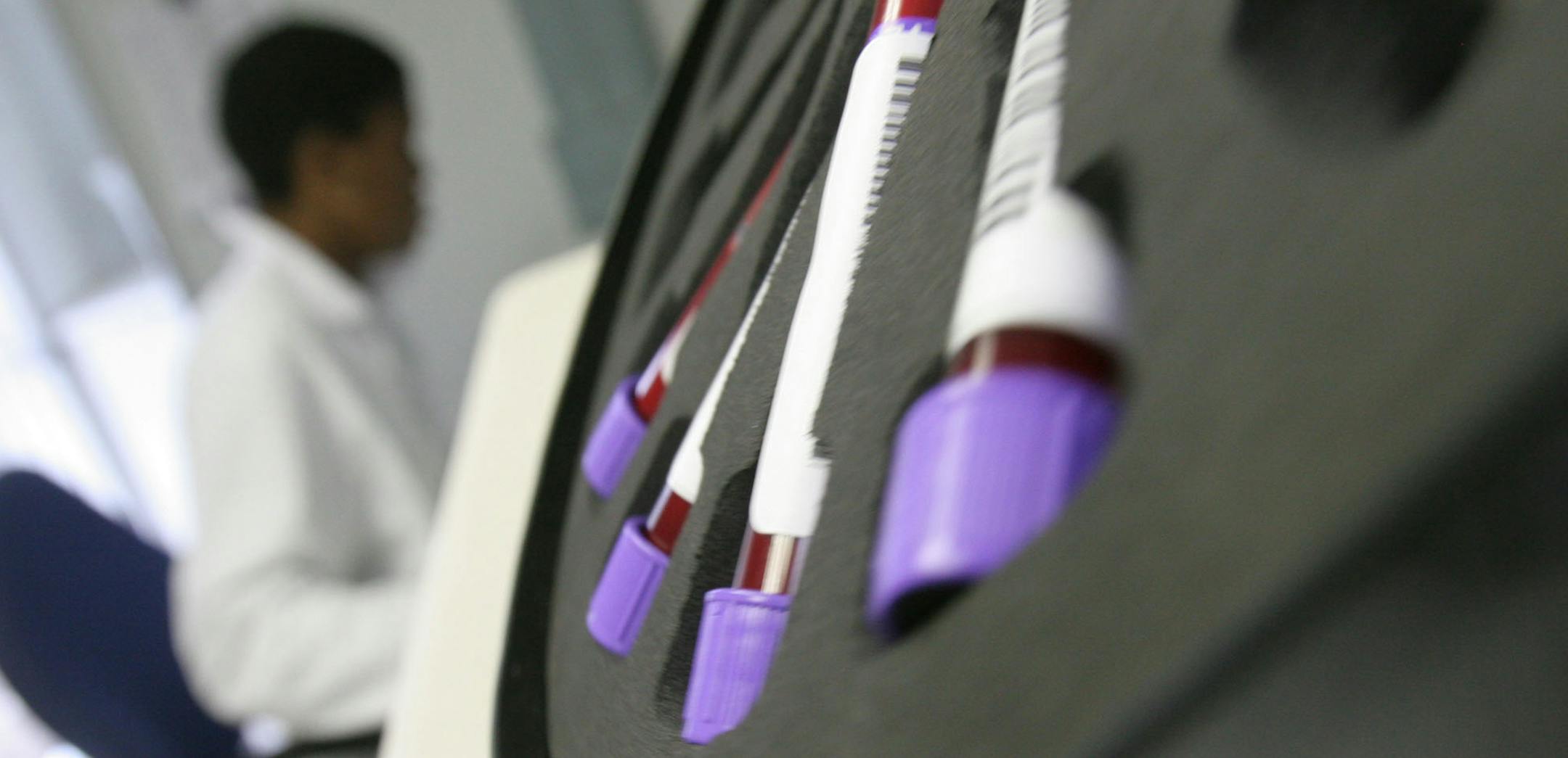 Blood is tested in a TOGA container converted into a laboratory at the AIDS Care Training and Support Initiative (ACTS) at White River Junction, South Africa, Monday Dec. 15, 2008. The center, partly funded by the President's Emergency Plan for AIDS Relief (PEPFAR) supports the development of a community-based palliative care unit which provides care, education and training for staff and community caregivers, volunteer counseling and testing facilities. (AP Photo/Denis Farrell) ORG XMIT: NY436