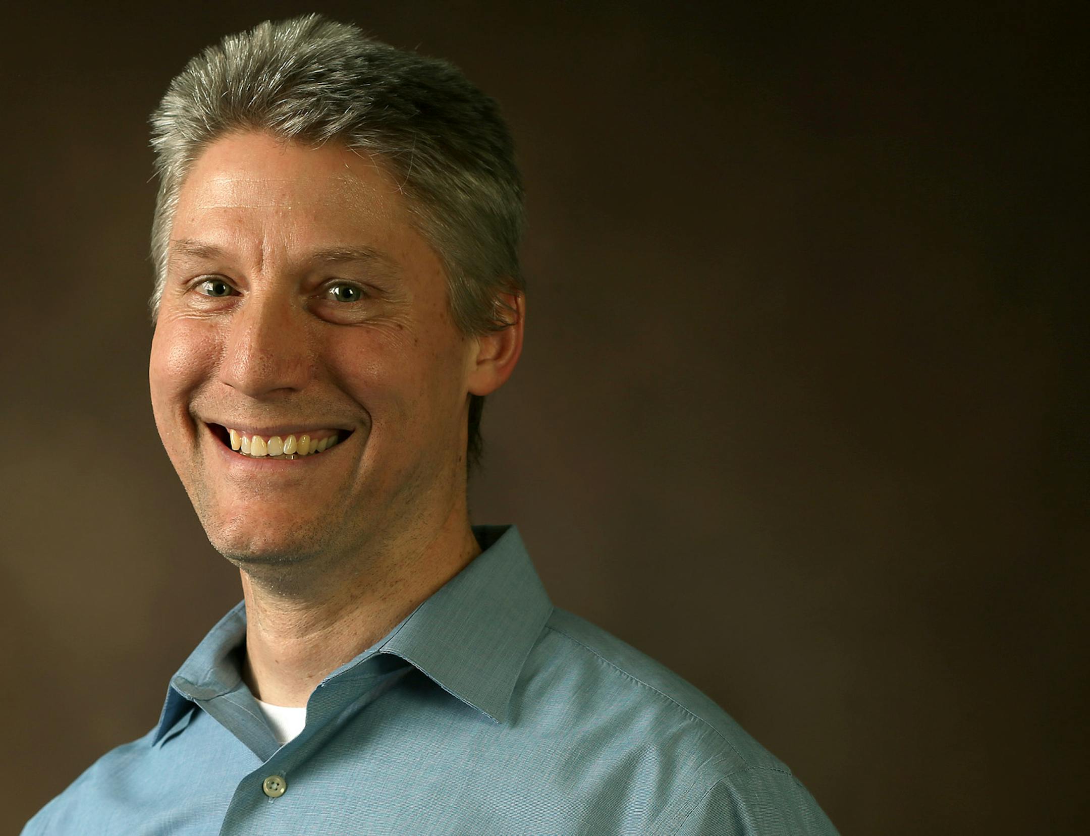 In this March 14, 2014 photo, Boston marathon qualifier Mike Johnson poses for a photo in Minneapolis, Minn. More than 600 Minnesota runners will line up for the start of the Boston Marathon this year, including 212 who ran last year and say they're going back to finish what they started. (AP Photo/The Star Tribune, Elizabeth Flores) (AP Photo/The Star Tribune, Flores, Elizabeth)