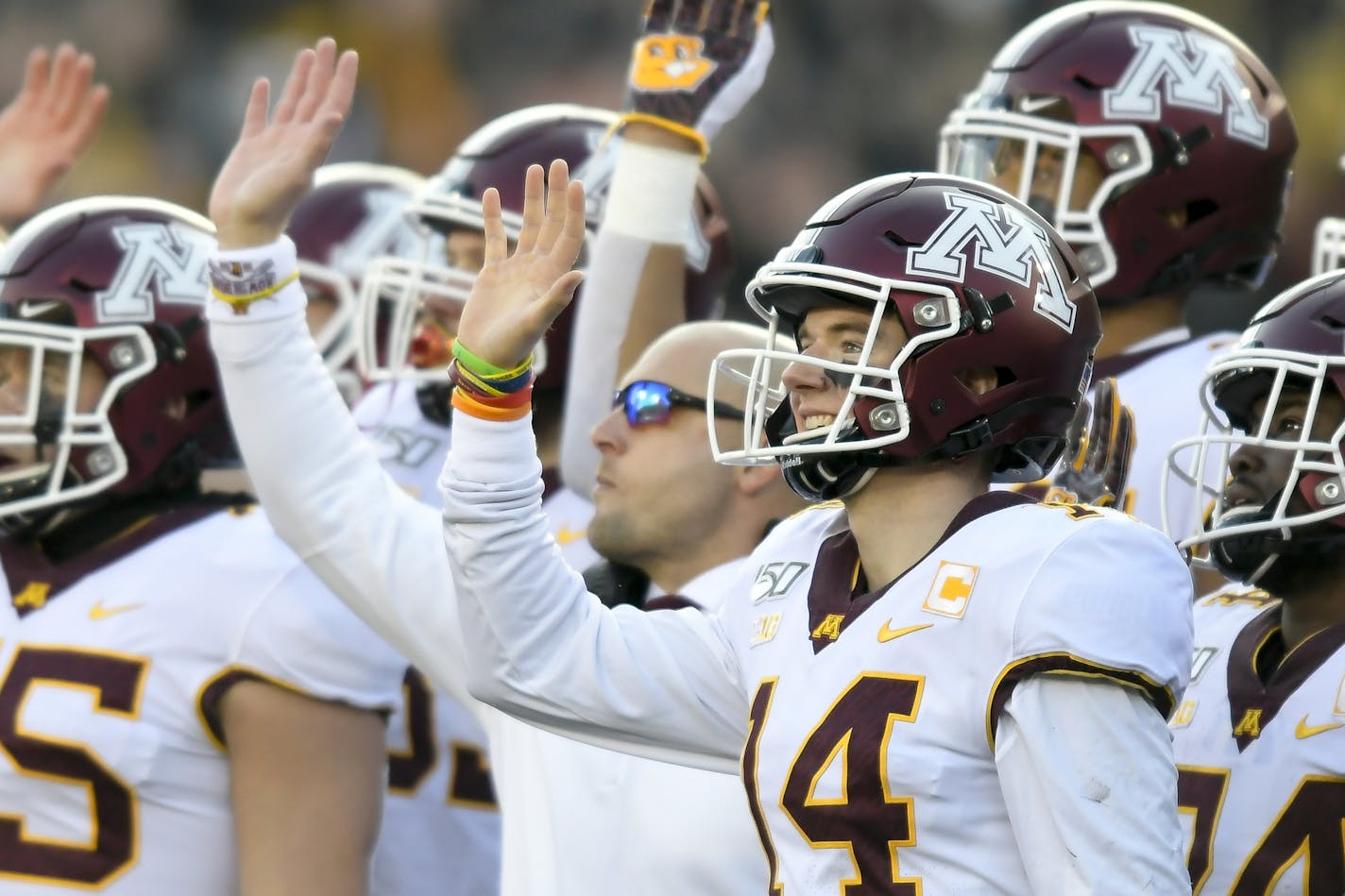 Minnesota Gophers punter Casey O'Brien (14) waved alongside head coach P.J. Fleck to patients at the University of Iowa Stead Family Children's Hospital between the first and second quarters. ] Aaron Lavinsky &#x2022; aaron.lavinsky@startribune.com The Minnesota Gophers played the Iowa Hawkeyes on Saturday, Nov. 16, 2019 at Kinnick Stadium in Iowa City, IA.