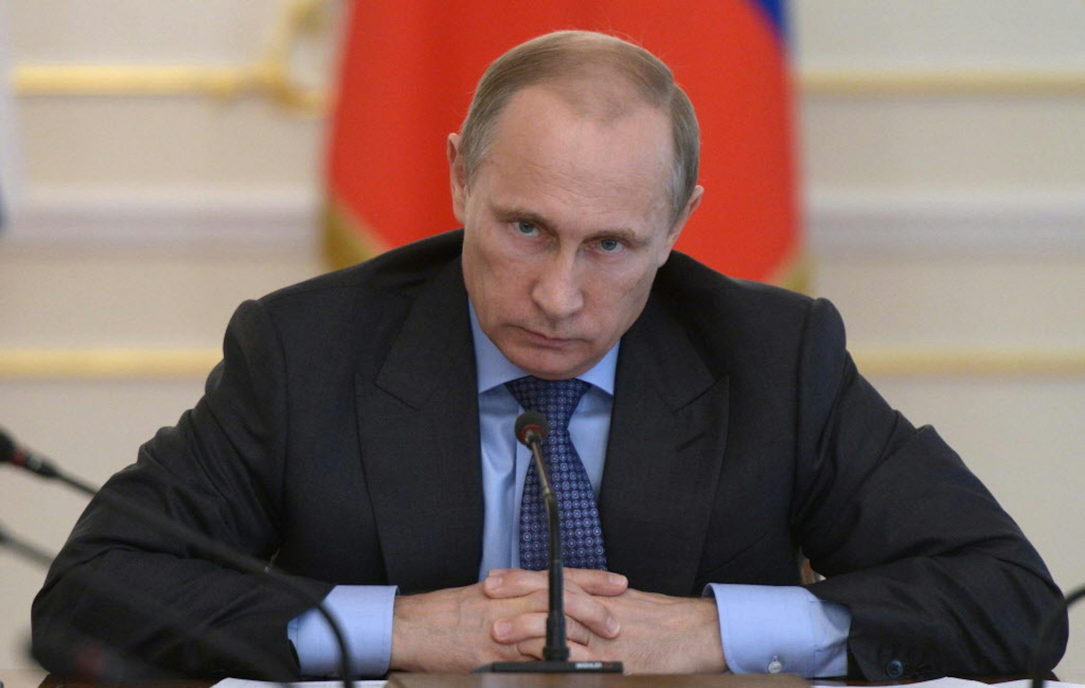 Russian President Vladimir Putin heads the Cabinet meeting in the Novo-Ogaryovo residence, outside Moscow, Russia, Wednesday, July 30, 2014. The meeting focused on measures to encourage Russian companies to pull their assets back from offshores. The United States and the European Union on Tuesday announced a raft of new sanctions against Russian companies and banks over Moscowís support for separatists in Ukraine. (AP Photo/RIA Novosti, Alexei Nikolsky, Presidential Press Service)