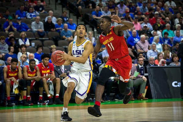 LSU guard Tremont Waters (3) drives to the basket against Maryland guard Darryl Morsell (11) during the first half of the second round men's college b
