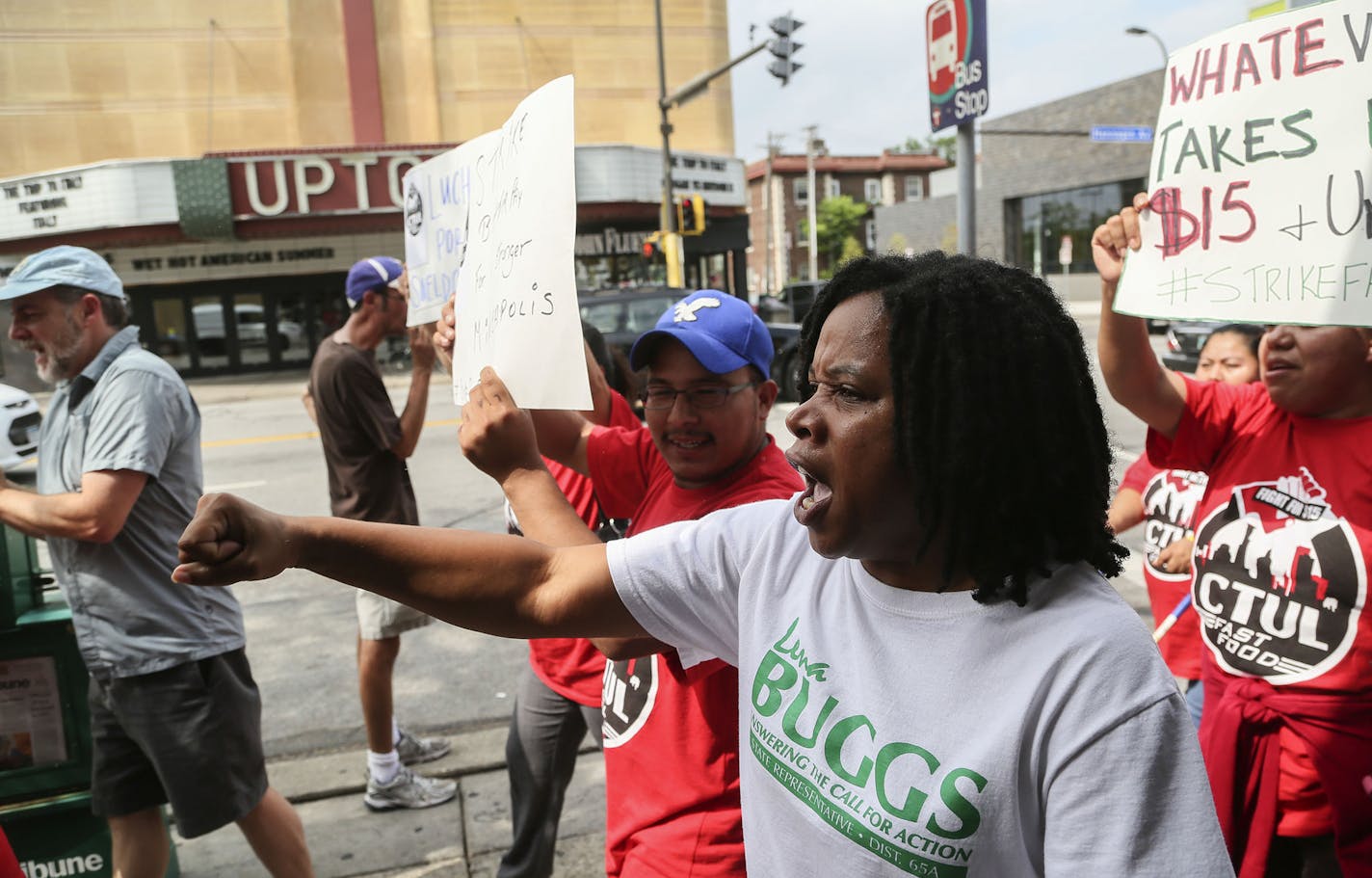 Food workers protested low wages and some struck to demand $15 an hour wages at the Uptown McDonalds Thursday, Sept. 4, 2014, in Minneapolis, MN. Here, among those protesting outside McDonalds was Lena Buggs, a candidate for state representative .](DAVID JOLES/STARTRIBUNE)djoles@startribune.com Food workers protested low wages and some struck to demand $15 an hour wages at the Uptown McDonalds Thursday, Sept. 4, 2014. Some cities in America have implemented a $15 minimum wage.