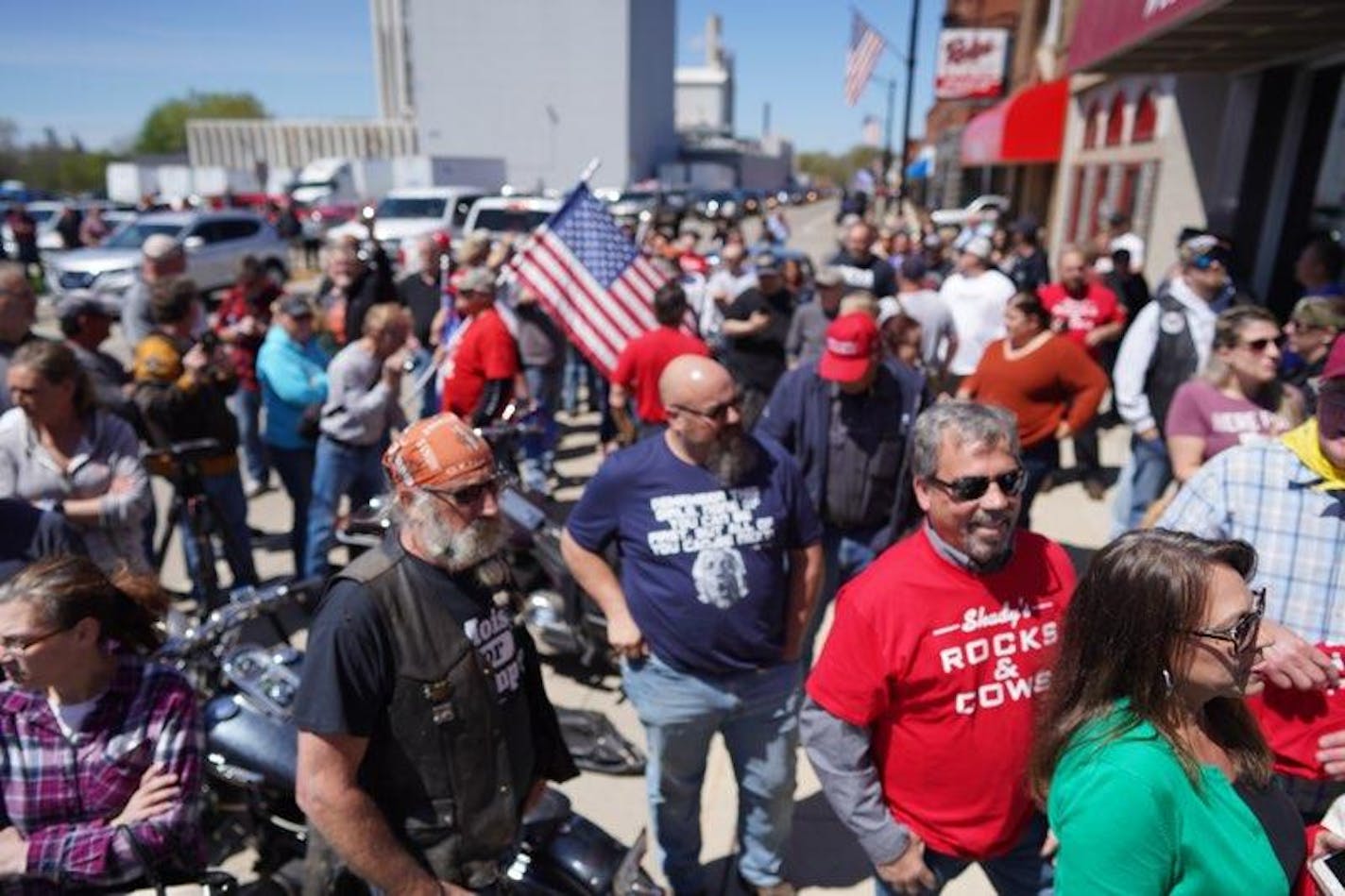 Crowds gathered outside Shady's Hometown Tavern in Albany, Minn., waiting for the doors to open before noon on Monday, May 18, 2020.