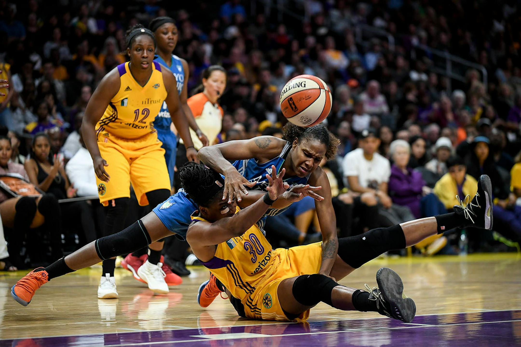 The ball was ripped from the hands of Minnesota Lynx forward Rebekkah Brunson (32) by Los Angeles Sparks forward Nneka Ogwumike (30) for a second quarter turnover Sunday.