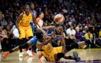 The ball was ripped from the hands of Minnesota Lynx forward Rebekkah Brunson (32) by Los Angeles Sparks forward Nneka Ogwumike (30) for a second quar