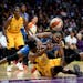 The ball was ripped from the hands of Minnesota Lynx forward Rebekkah Brunson (32) by Los Angeles Sparks forward Nneka Ogwumike (30) for a second quar