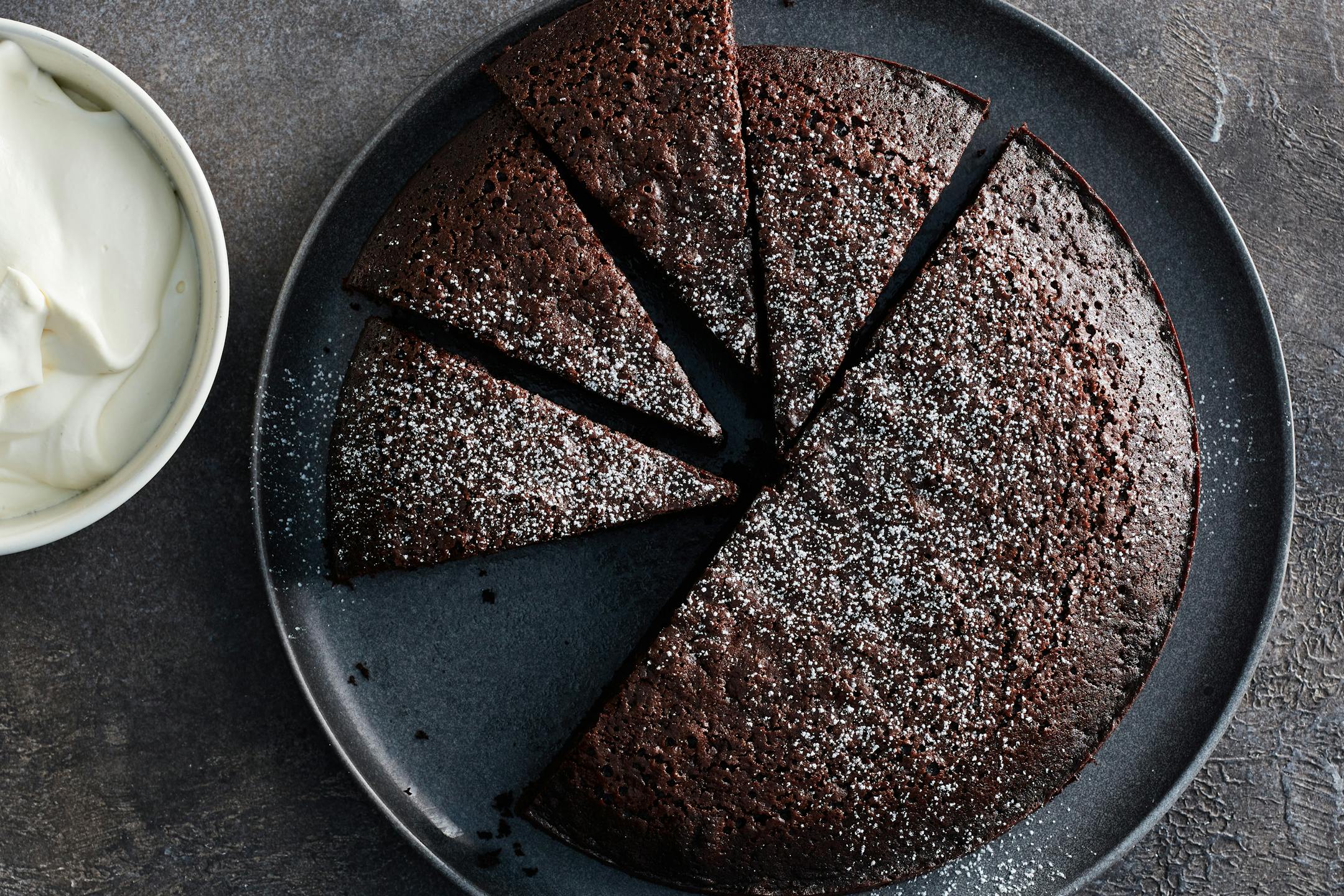 Chocolate olive oil cake in New York, Nov. 10, 2021. Earl Grey tea gives this chocolate olive oil cake a citrusy note, but you could also use coffee, orange juice or even red wine in its place. Food styled by Simon Andrews. (Johnny Miller/The New York Times)