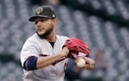 Minnesota Twins starting pitcher Martin Perez winds up during the first inning of the team's baseball game against the Seattle Mariners on Friday, May