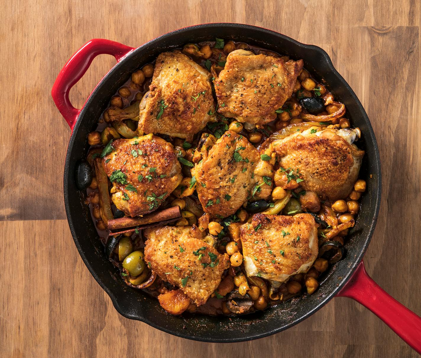 Chicken thighs get the braising treatment in Chicken Tagine with Fennel, Chickpeas and Apricots from ""The Complete Autumn and Winter Cookbook," by America's Test Kitchen. Credit: Daniel J. van Ackere, America's Test Kitchen