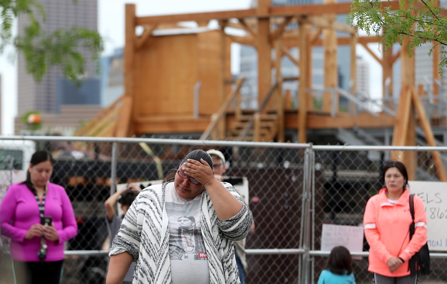 A new sculpture at the Walker Art Center that prompted an outcry among Minnesota's American Indian communities will be dismantled, the director said Saturday. Here, Crystal Norcross, a Sisseton Wahpeton Dakota from Sisseton S.D., spoke to a crowd near the piece, "Scaffold."