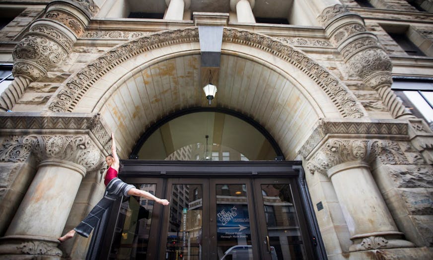 Sally Rousse, shown near the entrance of the Cowles Center, has created a new show celebrating the building.