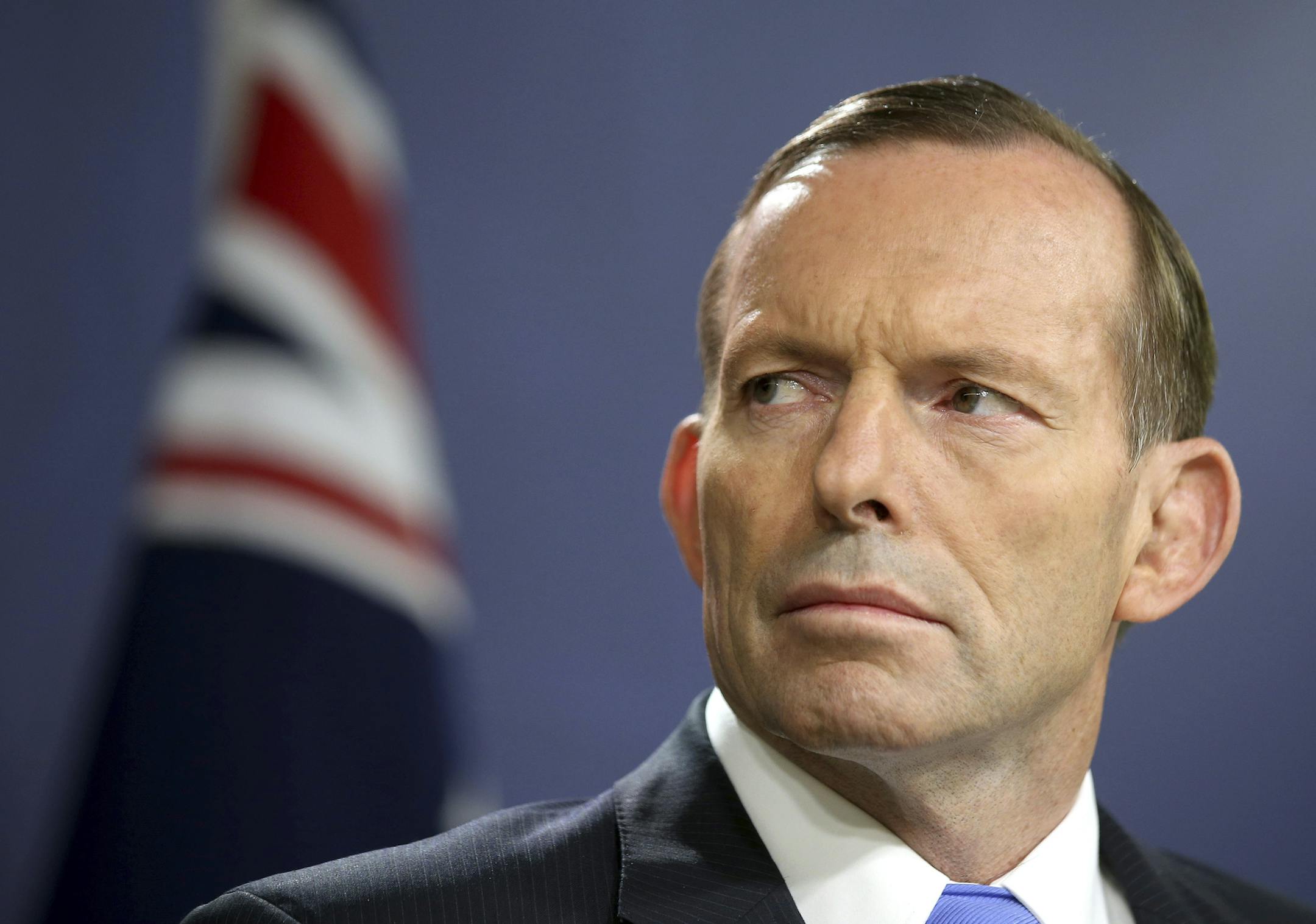 FILE - In this Sept. 19, 2014, file photo, former Australian Prime Minister Tony Abbott speaks during a press conference, in Sydney. Australia's Prime Minister Malcolm Turnbull confirmed Friday, Aug. 25, 2017, that his predecessor and intra-party rival Abbott had once been too drunk to vote in Parliament, an incident that's been a poorly kept secret in political circles for eight years.(AP Photo/Rick Rycroft, File)