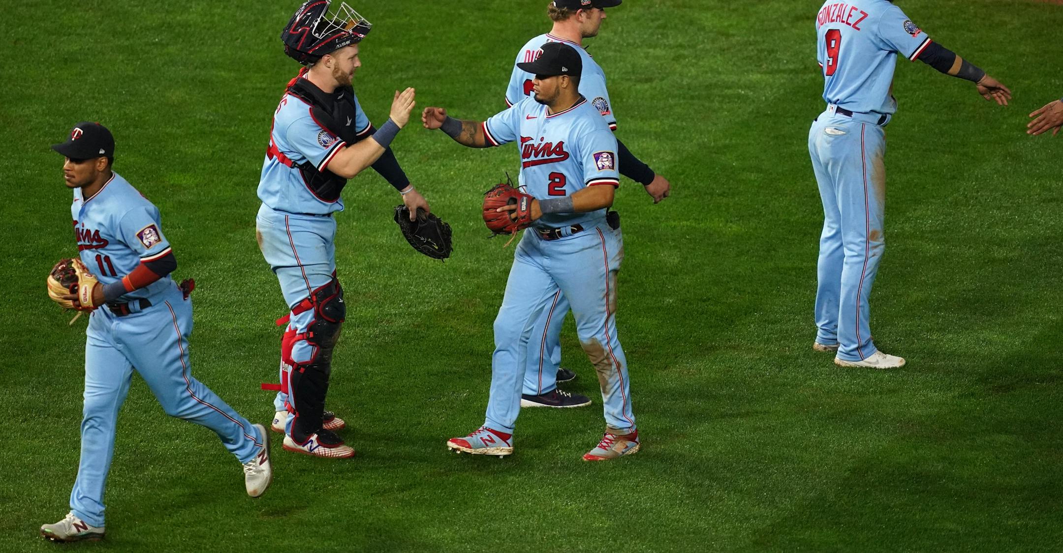 Minnesota Twins second baseman Luis Arráez (2) celebrated the win with his teammates.