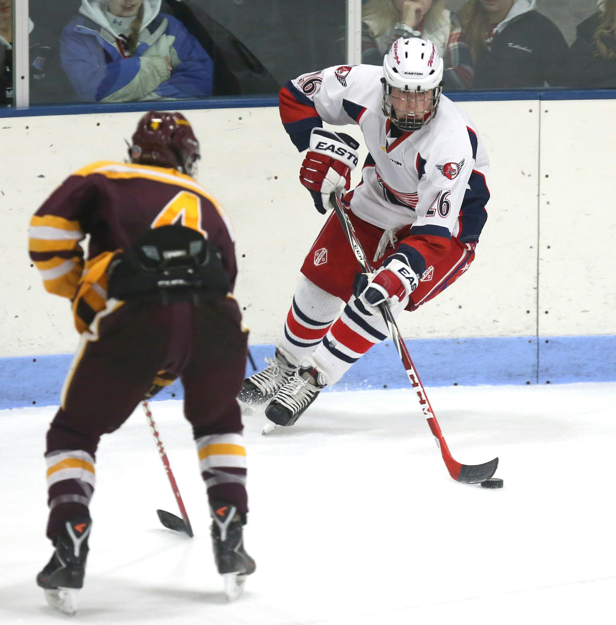 Armstrong/Cooper’s Kyle Sweeney, shown skating down the ice against Irondale, was one of 61 players who showed up for tryouts for 38 spots.