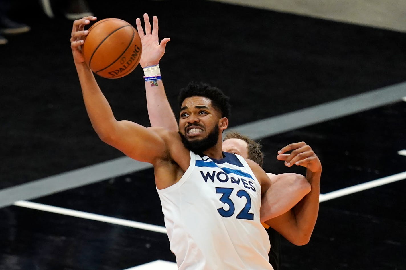 Minnesota Timberwolves center Karl-Anthony Towns (32) reaches for a pass during the second half of an NBA basketball game against the Utah Jazz Saturday, Dec. 26, 2020, in Salt Lake City. (AP Photo/Rick Bowmer)