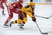 Gophers standout Abbey Murphy tried to skate away from Wisconsin defenseman Laney Potter when the teams met in December.