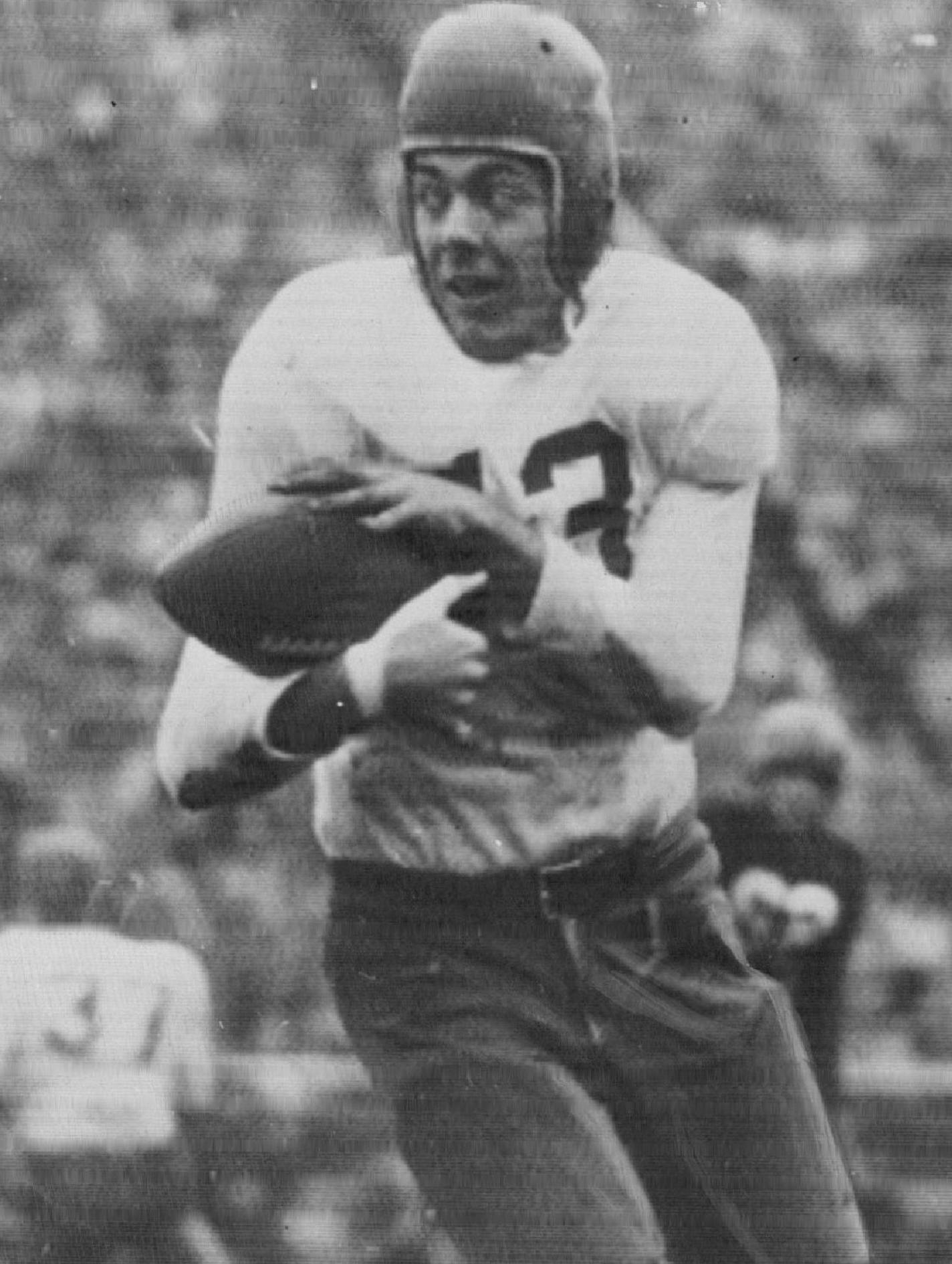 November 21, 1948 Wisconsin's Joe Kelly chases as Bud Grant grabs a Gapher pass for eight yards. October 20, 1948 AP Wirephoto; Minneapolis Star Tribune ORG XMIT: MIN2018010918420829