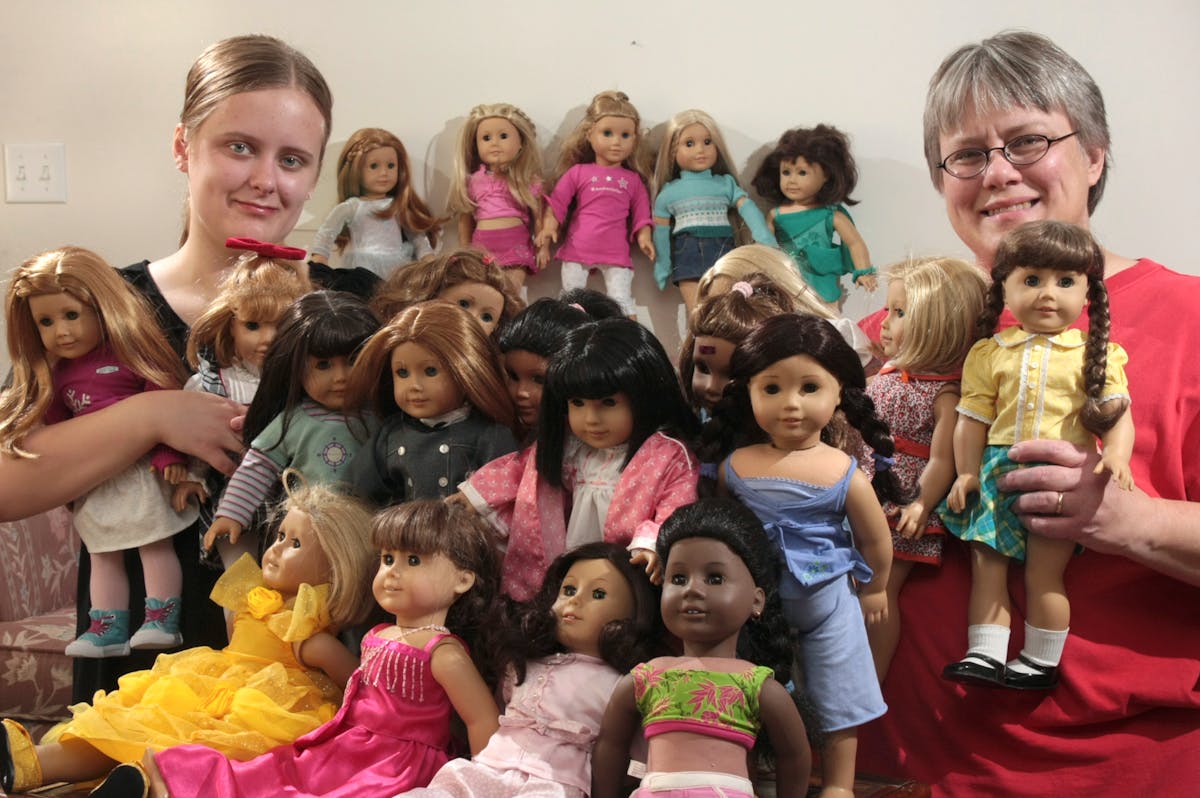 Katie ( left) and Connie Johnson display their collection of 24 American Girl Dolls