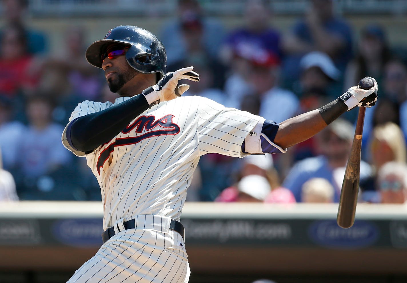 Minnesota Twins' Eduardo Nunez follows through on a three-run home run off Toronto Blue Jays relief pitcher Gavin Floyd during the eighth inning of a baseball game in Minneapolis, Saturday, May 21, 2016. The Twins won 5-3. (AP Photo/Ann Heisenfelt)