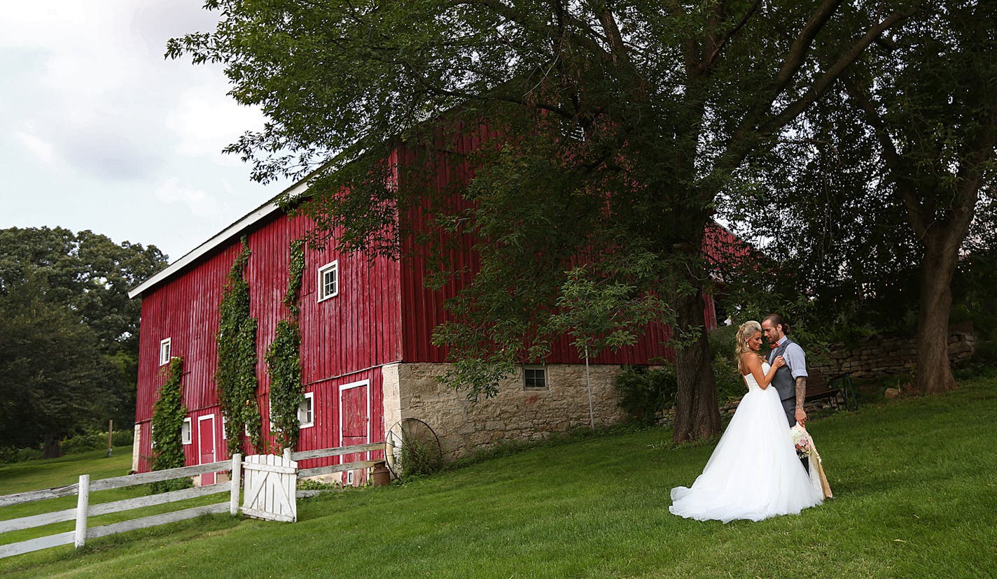 Newlyweds Savannah and Jeremy Eckert posed for photographs following the ceremony. ] JIM GEHRZ &#xef; james.gehrz@startribune.com / Cottage Grove, MN / August 28, 2015 / 3:00 PM &#xf1; BACKGROUND INFORMATION: The sudden flourishing of wedding barns and other farmyard attractions, why the lure of such things just now, and the fightbacks that can happen with neighbors. A wedding is occurring at a wedding barn in Cottage Grove, Hope Glen Farm -- bride Savannah puts on wedding dress 2:20 pm / then b