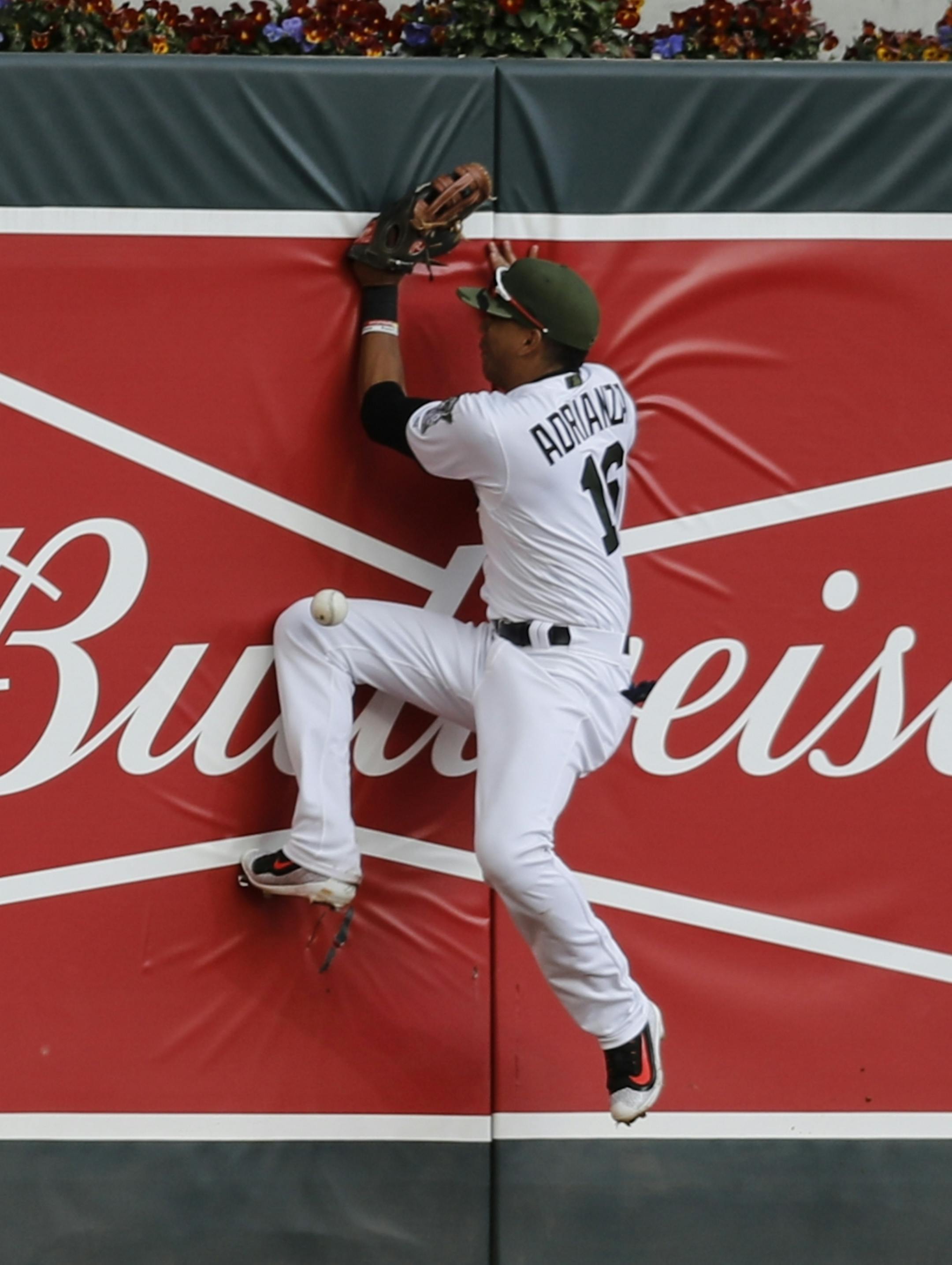 Minnesota's Ehire Andrianza missed the catch as he jumped into the wall to catch a single by Houston's Marwin Gonzalez (9) that scored two runs in the eighth inning at Target Field in Minneapolis, Minn. on Monday, May 29, 2017.