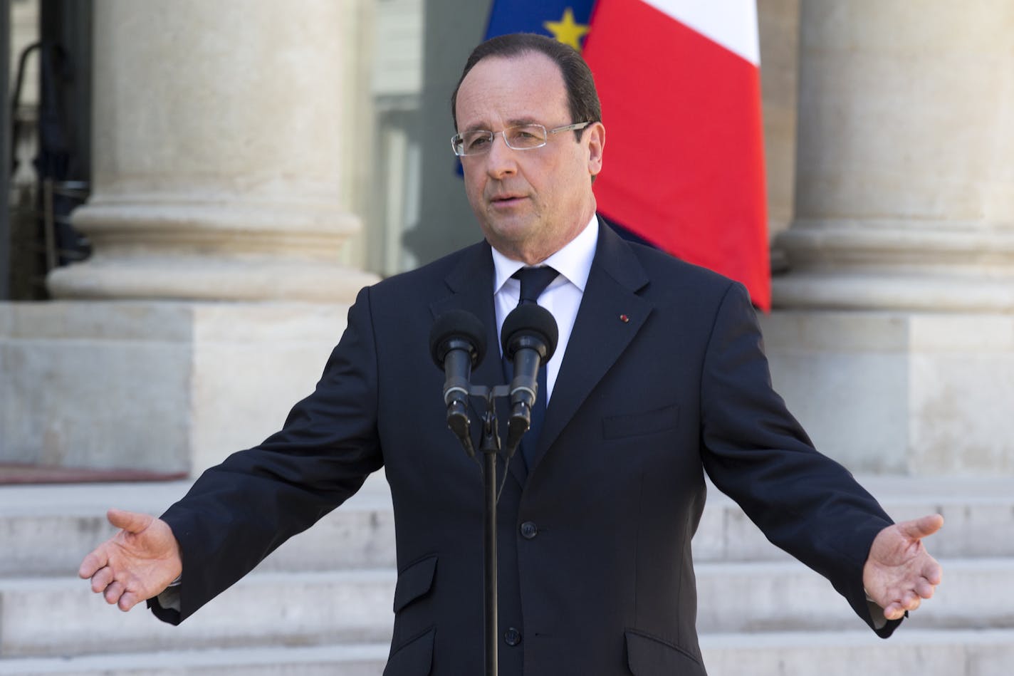 FILE - In this April 24, 2013 file photo, French President Francois Hollande talks to the media after the weekly cabinet meeting in Paris. The sounds of raucous protest echo in the Presidential Palace, unemployment among is rising inexorably, and his country's economy has been called a potential time bomb at the heart of Europe. Hollande, among the most unpopular French leaders in modern history, remains calm. (AP Photo/Jacques Brinon, File) ORG XMIT: MIN2013051516574671