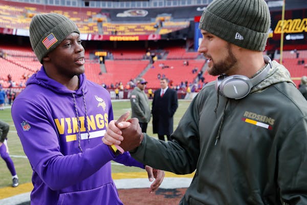 Teddy Bridgewater and Kirk Cousins before a game between the Vikings and Washington in 2017.