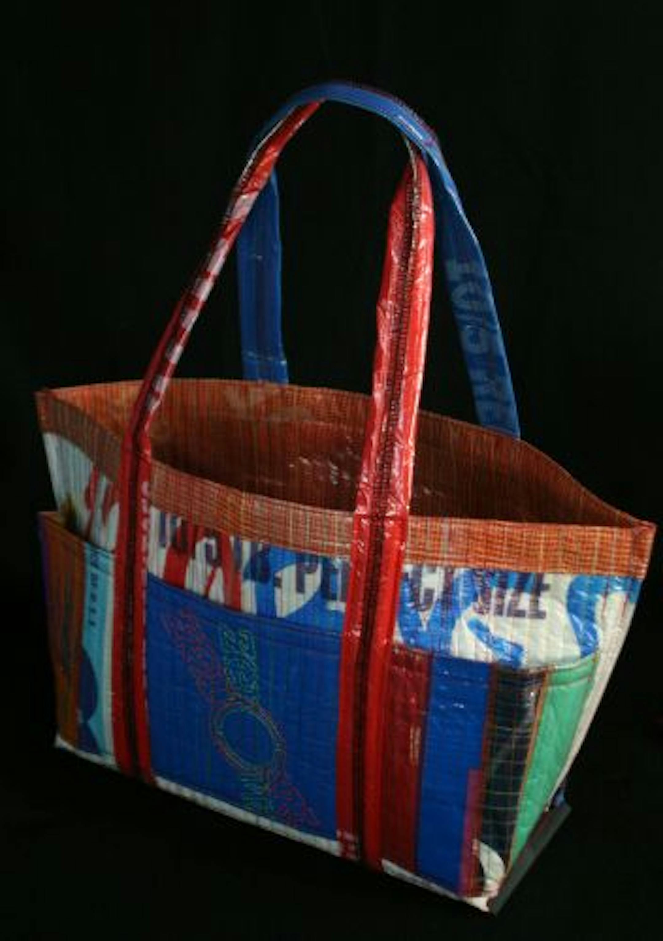 The Random Stripe Supplies Tote is a product of ZerOw Bags, a local business that creates bags out of recycled plastics. ZerOw Bags was created in August 2008 by Paule Hempe and Chad Campbell.