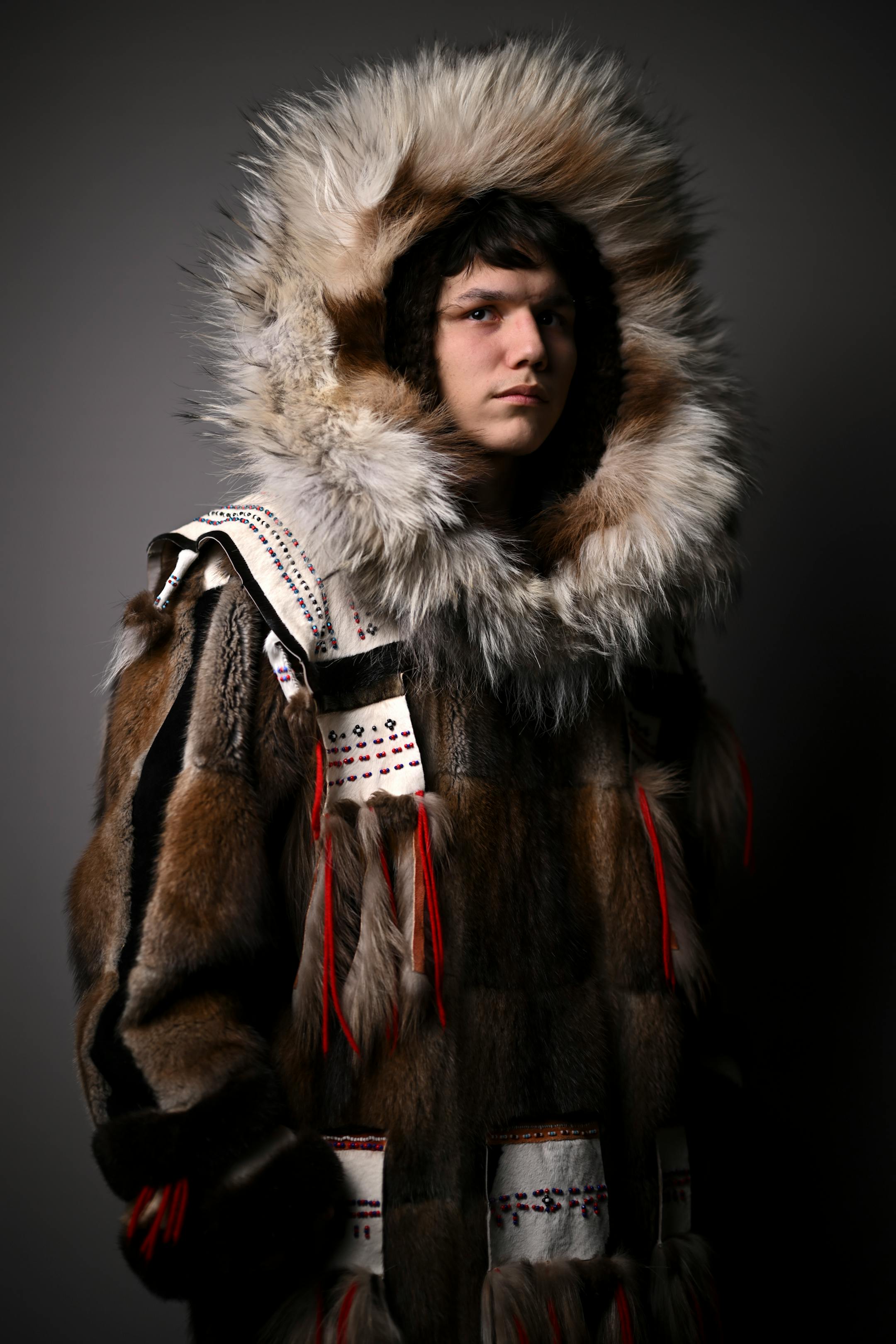 Ernie Johnson stands for a portrait during "Northern Lights: A Native Nations Fashion Night." Johnson is wearing apparel by Golga Oscar, a Yup'ik fashion designer from Alaska, who uses seal skin and wolf fur.