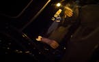 An Uber and Lyft driver waited to pick up passengers at Lagoon Avenue and Hennepin Avenue early Sunday morning. ] (AARON LAVINSKY/STAR TRIBUNE) aaron.