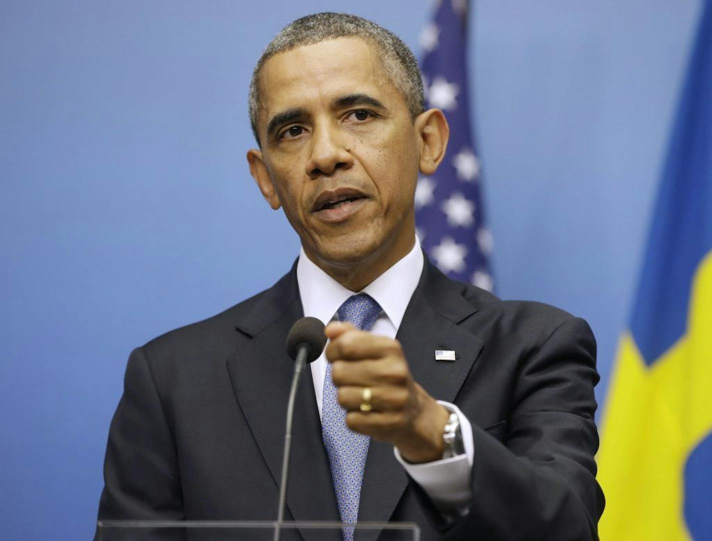 President Barack Obama gestures during his joint news conference with Swedish Prime Minister Fredrik Reinfeldt, Wednesday, Sept. 4, 2013, at the Rosenbad Building in Stockholm, Sweden.