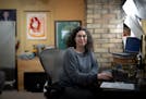 Software developer Lisa Mabley works from her home office on Monday in Minneapolis. Mabley was laid off from her job a year ago and applied to 300 pla