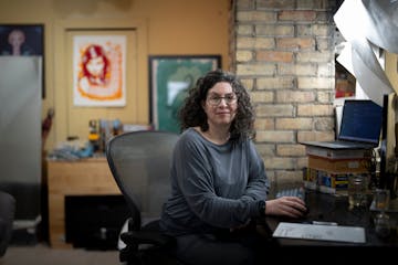 Software developer Lisa Mabley works from her home office on Monday in Minneapolis. Mabley was laid off from her job a year ago and applied to 300 pla