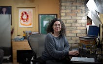 Software developer Lisa Mabley works from her home office on Monday in Minneapolis. Mabley was laid off from her job a year ago and applied to 300 pla