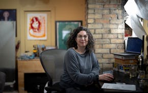 Software developer Lisa Mabley works from her home office on Monday in Minneapolis. Mabley was laid off from her job a year ago and applied to 300 pla