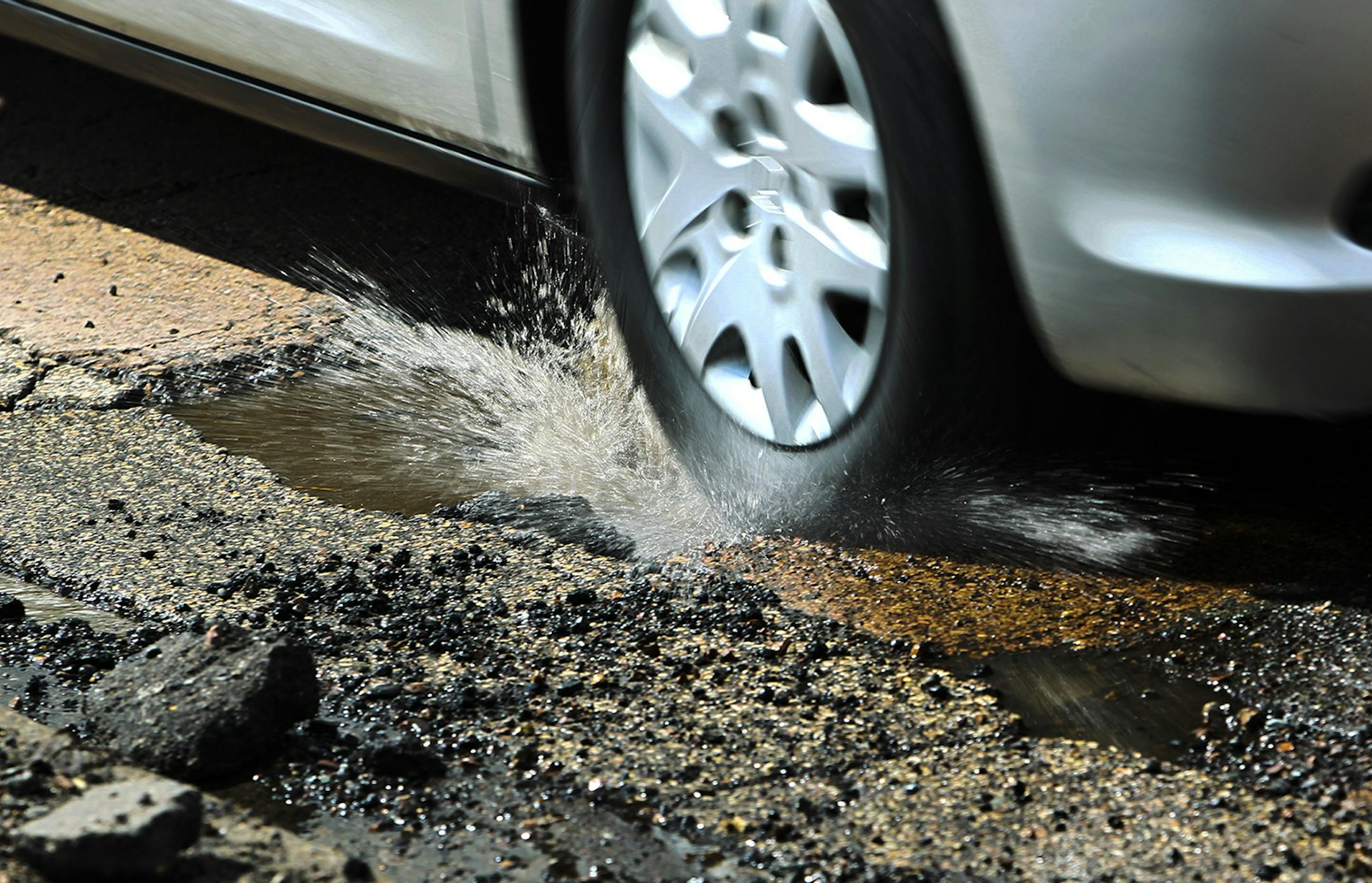 Cars driving on E. Minnehaha Parkway along Lake Nokomis tried to dodge potholes in the roadway Tuesday, April 23, 2013, in Minneapolis, MN.](DAVID JOLES/STARTRIBUNE) djoles@startribune.com On a stretch of West River Parkway, southbound drivers have been known to shift into the oncoming lane to avoid the plethora of potholes. The surface has been patched so many times that the jolting can leave a cyclist feeling scatter-brained. Help is on the way for this stretch of road, which will be closed ne